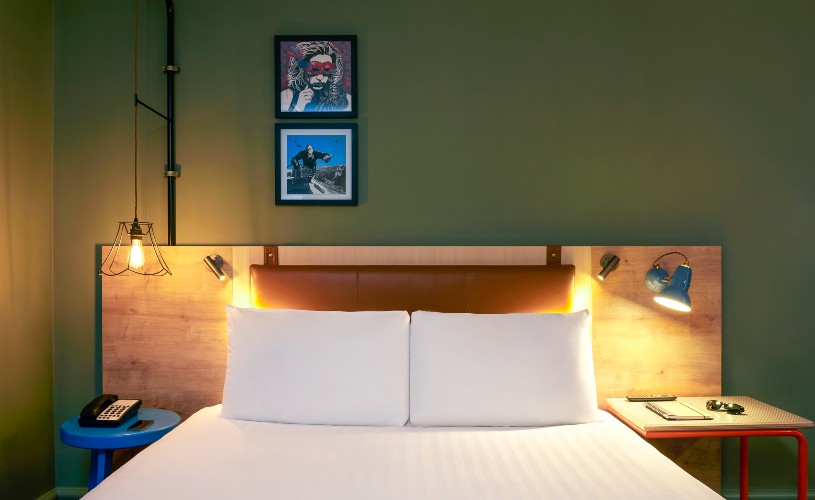 Double bed with artwork above at Mercure Bristol Grand Hotel